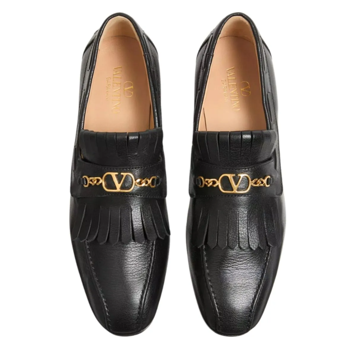 MOCCASINS WITH GOLD V LOGO SIGNATURE AND FRINGES.
